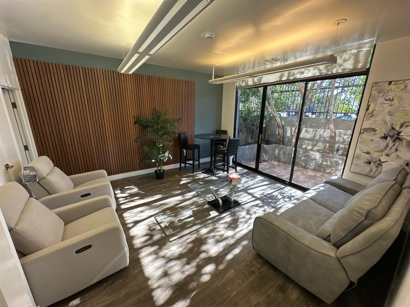 Sunlit resident lounge with comfortable seating